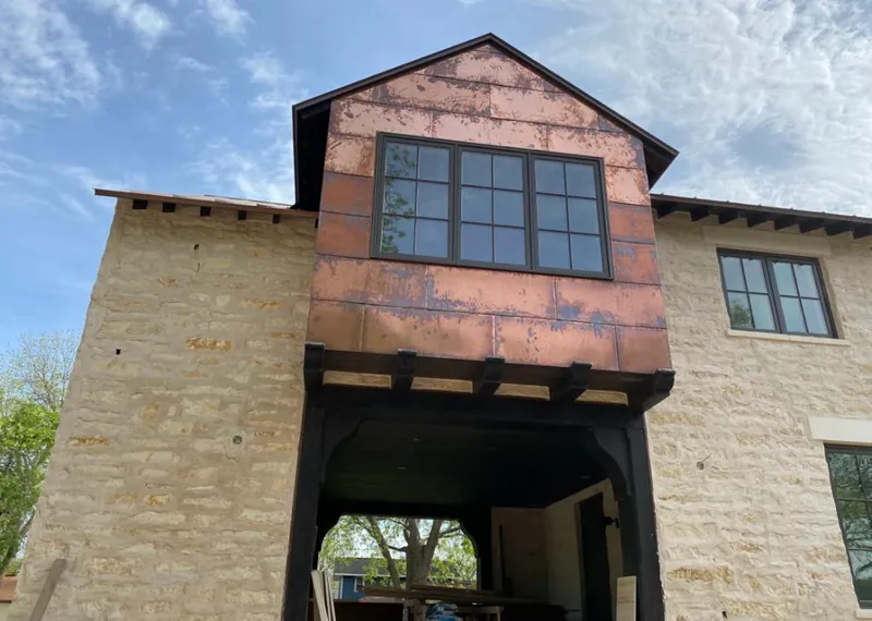 Copper metal panel facade on a stone building for Metal Roof Coating in South San Gabriel